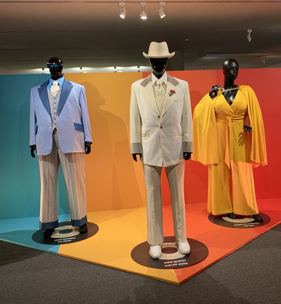 NetflixTudum's tweet photo. In Toronto for #TIFF19? (Or not! It’s open to the public!) Drop by the Lightbox to see costumes designed by @iamRuthECarter and props from DOLEMITE IS MY NAME https://t.co/TN2BZldNTC