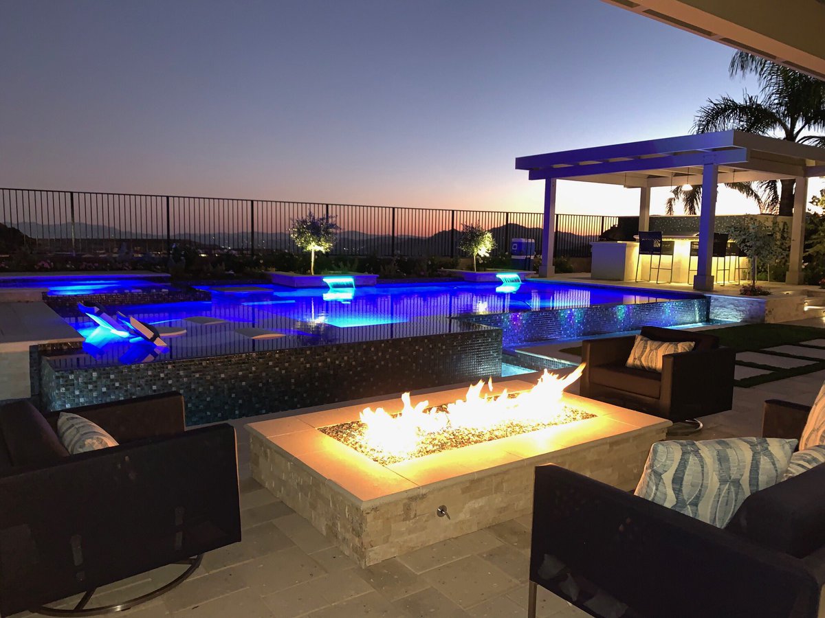 Just finished this #stunning #backyardretreat from the #outdoorkitchen to the stone and #glassfirepit you too could have an #amazingbackyard like this.