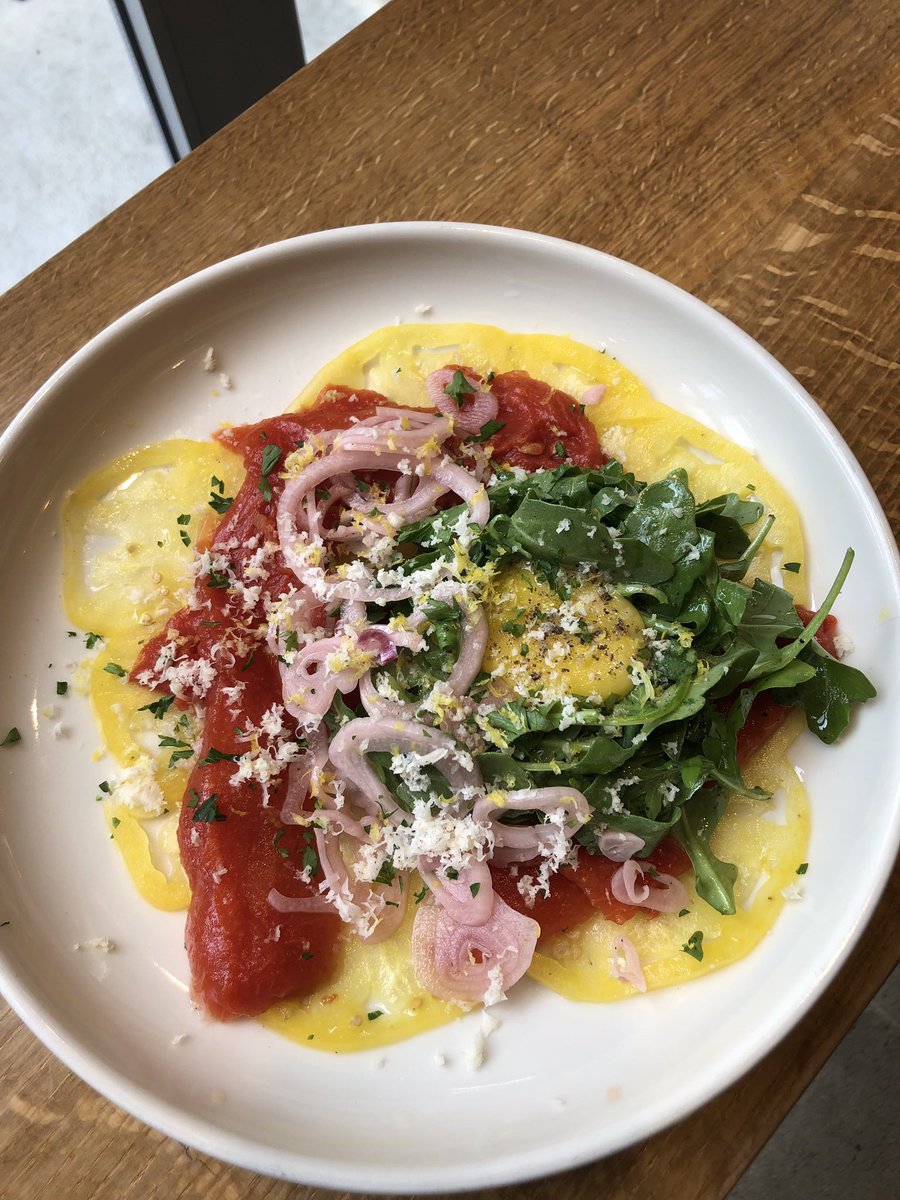 Roasted watermelon and heirloom tomato carpaccio, served with pickled shallots, arugula, cured egg yolk #kingdough #kingdoughindy #kingdoughpizza