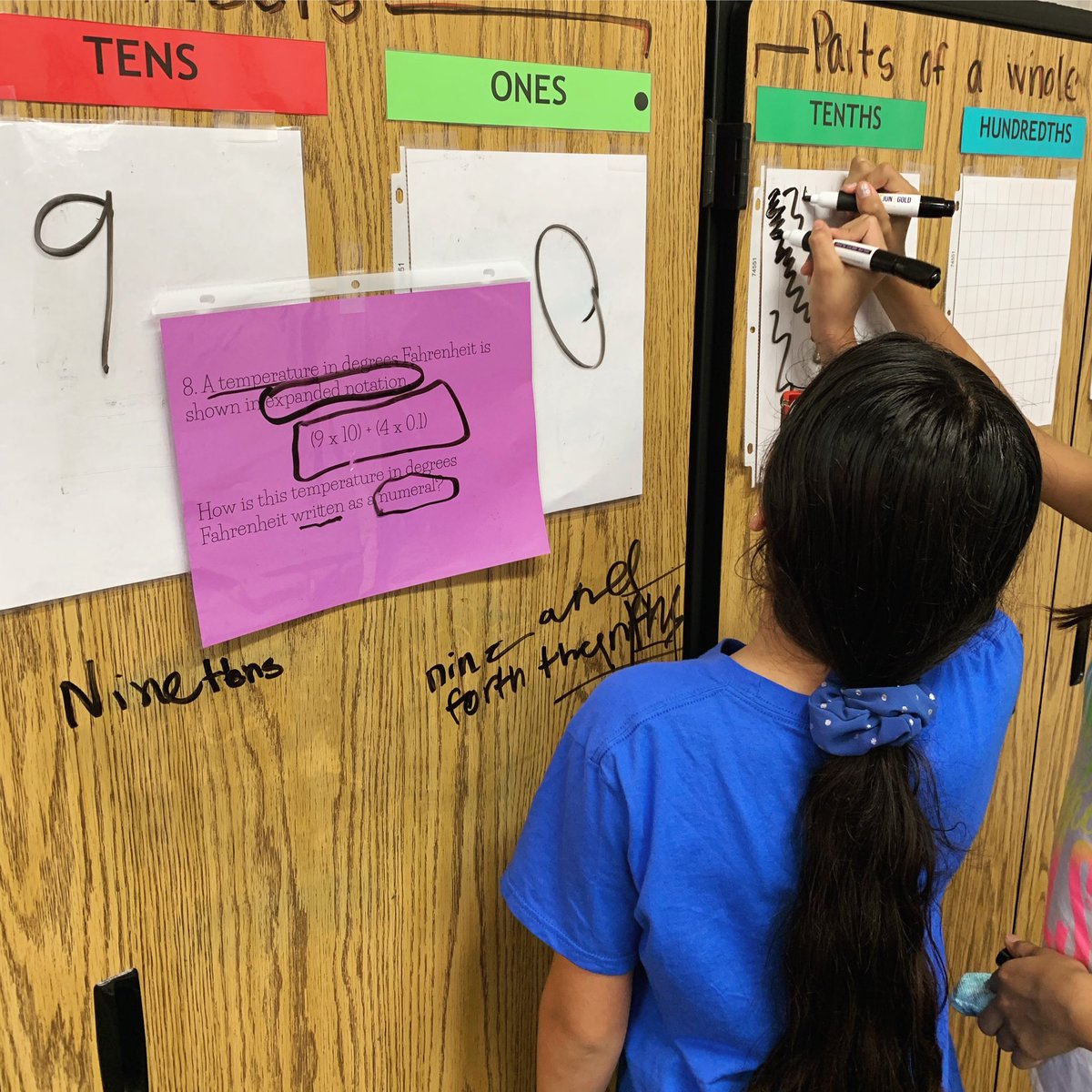 Couple of friends using an interactive place value chart to help them understand expanded notation #bewillbern