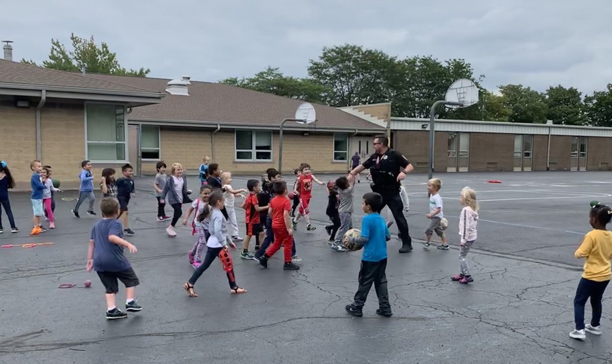 IFAS_1's tweet image. The kindergarteners loved playing with officer Klimek at recess today! @LyleDragons