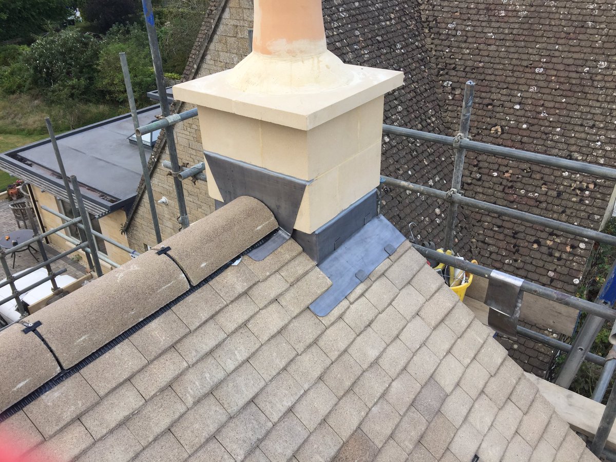 Lead flashings around a chimney stack, before and after #leadwork #roofing #oxford