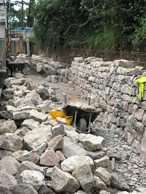 Beunos's tweet photo. A work of art! Here are some photos of the beautiful dry stone wall being built by very skilled craftsmen here at St. Beunoโs. #truecraftsmanship #realskill #thingofwonder #forthefuturegenerations https://t.co/YKeWOHHduh