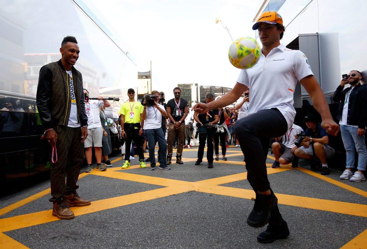 McLarenF1's tweet photo. Thanks for joining us for a kick-about in the paddock, @Aubameyang7. ⚽️🙌

@Carlossainz55 will await your call @Arsenal. 😉 https://t.co/q92IXzad2X