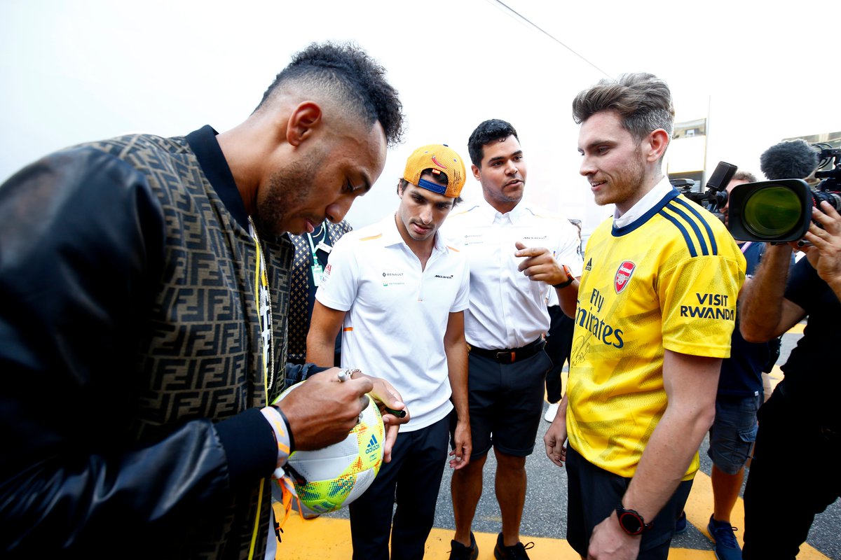 McLarenF1's tweet photo. Thanks for joining us for a kick-about in the paddock, @Aubameyang7. ⚽️🙌

@Carlossainz55 will await your call @Arsenal. 😉 https://t.co/q92IXzad2X
