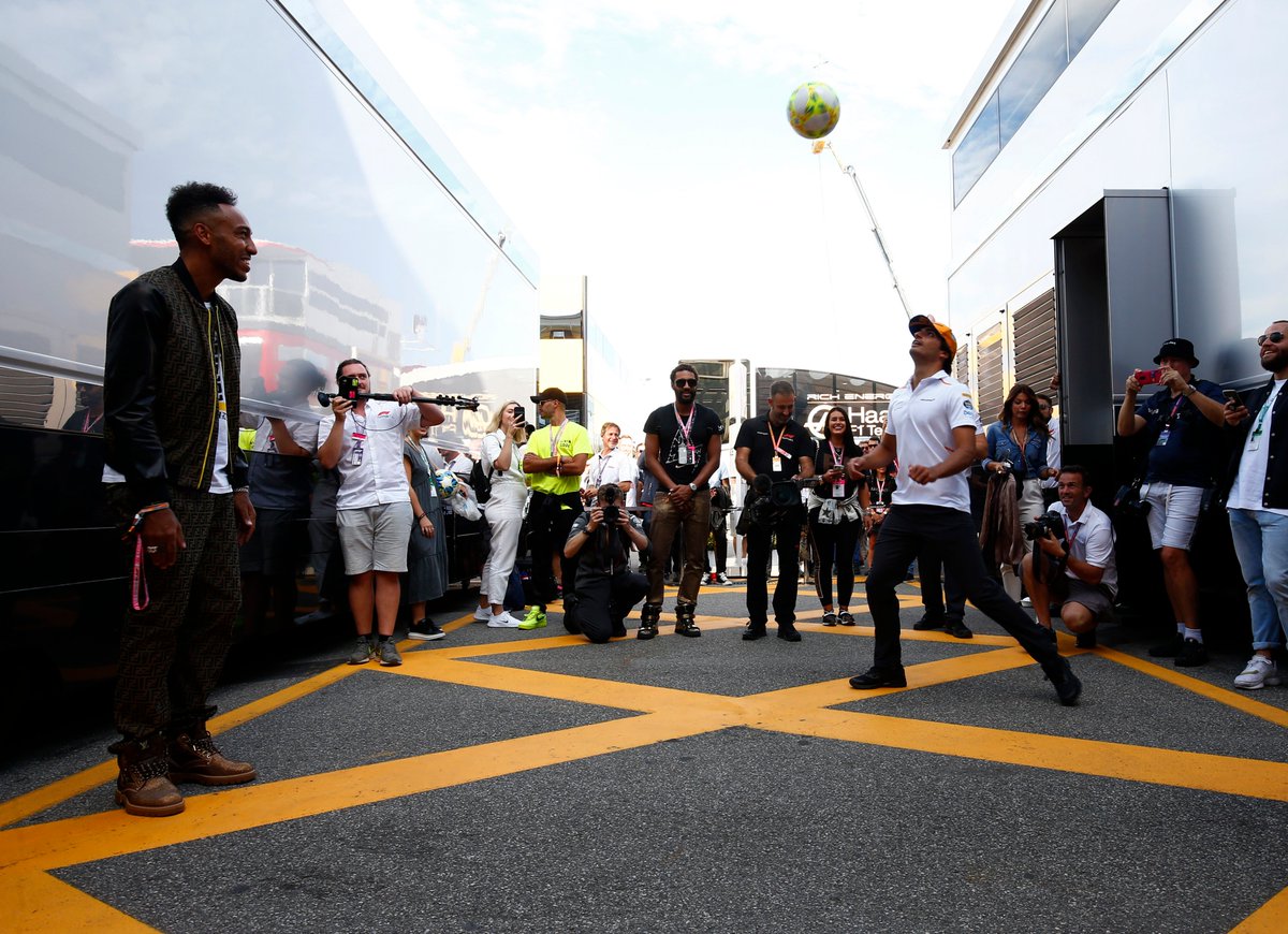 McLarenF1's tweet photo. Thanks for joining us for a kick-about in the paddock, @Aubameyang7. ⚽️🙌

@Carlossainz55 will await your call @Arsenal. 😉 https://t.co/q92IXzad2X