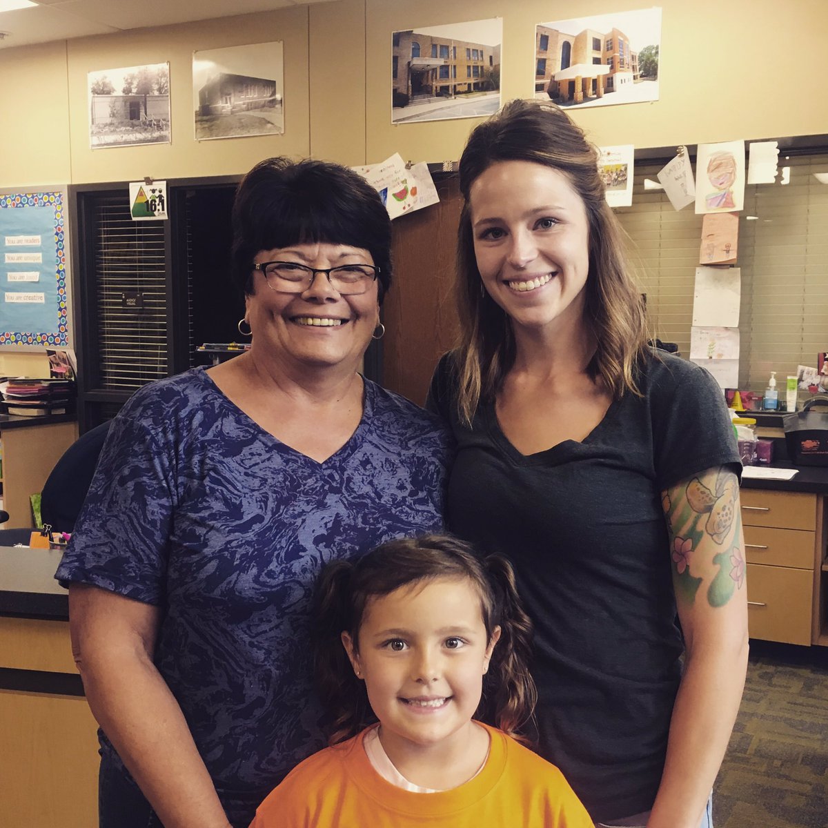Three generations <a href="/Iveland_Rocks/">Iveland Elementary</a> in this photo with the evolution of the Iveland campus above their heads in the background. Also, grand daughter is doing Kindergarden this year in the very same classroom that grandma did kindergarten years ago 🤯🤯 #Legacy #RitenourExcellence