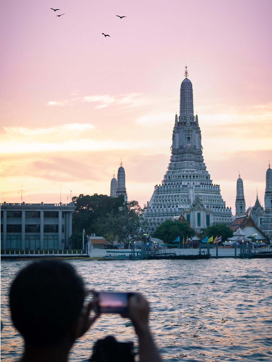 MO_BANGKOK's tweet photo. Temple of Dawn (locally known as Wat Arun) iDespite the name, the most spectacular view of the glittering pagoda can be seen from the east side of the river at sunset, when the spires of Wat Arun make an impressive silhouette against the skyline. https://t.co/Dq5qHxSbr2