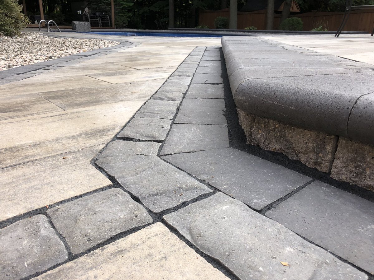 Avari 50mm Glacier creek with Richmond UB and Corso GM accent borders. 2400sqft transformation. 78yds Hpb 9yds topsoil 14yds riverstone. 30 pallets of pavers/slabs, segmental, and bullnose/coping and a 900lb jumping rock #ydinitiative #hardscapelife #hardscapebrotherhood