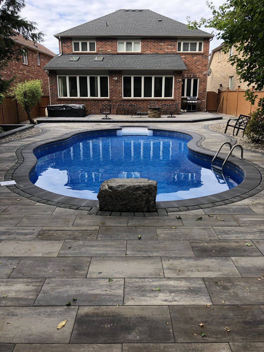 YDInterlocking's tweet photo. Avari 50mm Glacier creek with Richmond UB and Corso GM accent borders. 2400sqft transformation. 78yds Hpb 9yds topsoil 14yds riverstone. 30 pallets of pavers/slabs, segmental, and bullnose/coping and a 900lb jumping rock #ydinitiative #hardscapelife #hardscapebrotherhood https://t.co/XUPCWkLFZr