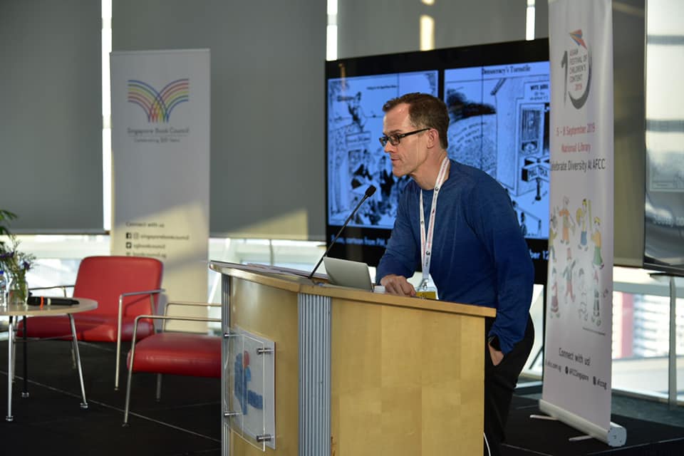 englishkstate's tweet photo. Faculty @KState_RSCAD in action: Phil Nel @philnel presented a keynote lecture on diversity and children's literature at the 2019 Asian Festival of Children's Content in Singapore @AFCC_sg #AFCC2019 https://t.co/nJx5DGQ2nt
