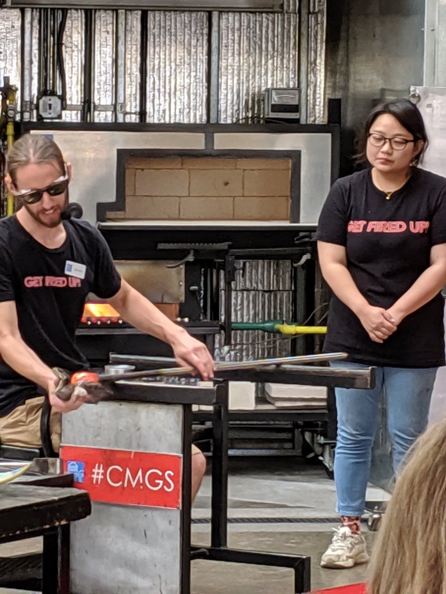 RFeldhausAdams's tweet image. The studio is in a building that used to be a bank, and the original vault is still intact. 

Here Luke works w assistant Sue on what will become a pitcher. Luke uses wet newspaper to smooth the hot glass. #hrva #cmgs