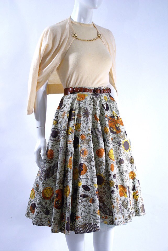 kateStrasdin's tweet image. A #1950s ensemble that marries the chasteness of a cream knitted #twinset with the modernist craziness of an atomic inspired printed cotton skirt @FashionHistoryM #fashionhistory