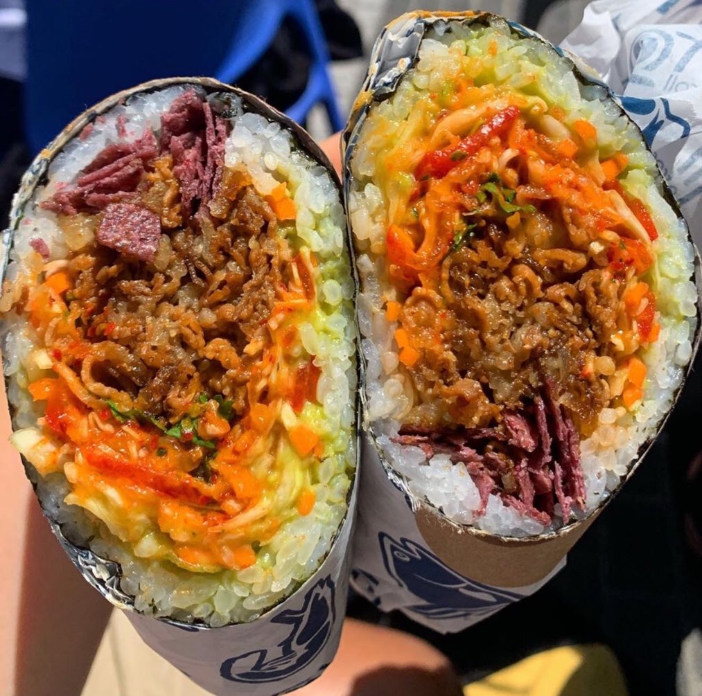 Sushirrito's tweet photo. Not a huge fish fan? Try “The Cowboy”, loaded with Kabayaki Beef, Blue Corn Chips, Green Cabbage, Red Radish, Julienne Carrots, Red Peppers, Ginger Guac, Cilantro and Kimichurri Sauce! https://t.co/0R0kTuuBQ0