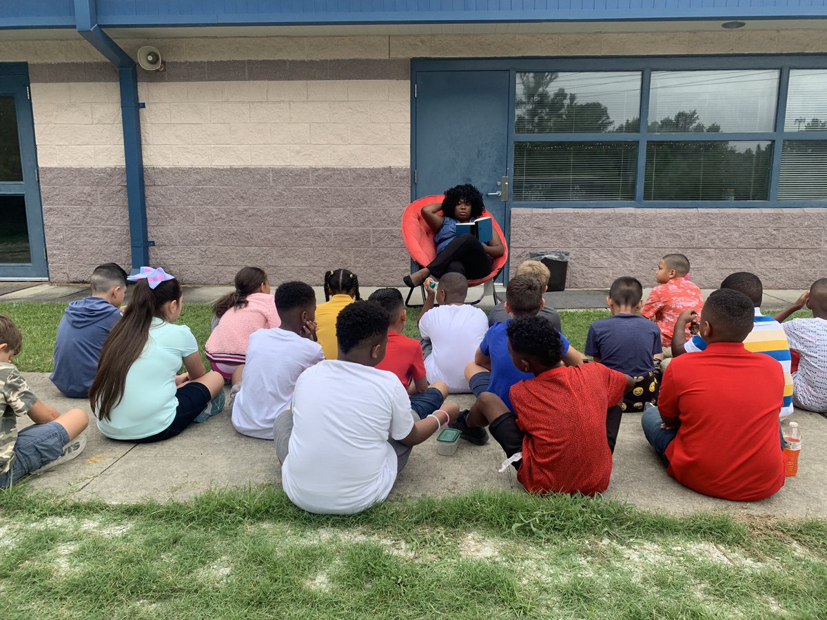 Decided to take advantage of the weather and take our read aloud outside. #globalstemleaders