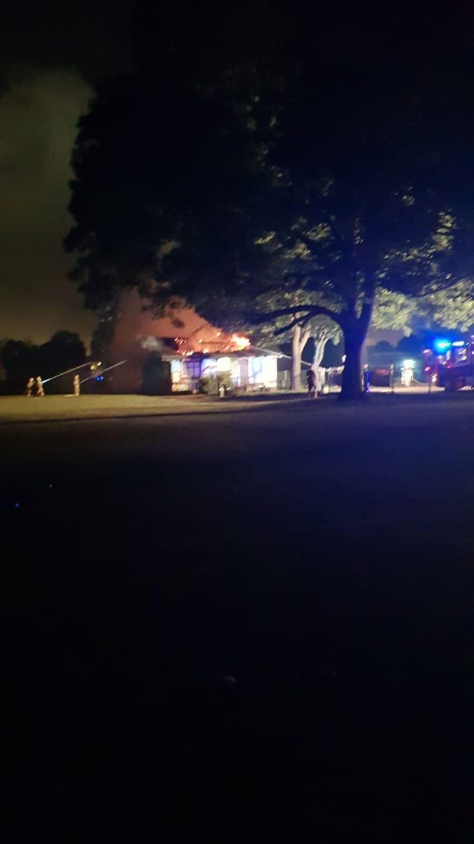 Shrublands_FC's tweet photo. We are deeply saddened this morning too stand and watch our clubhouse burn down. Every person involved with the club now has nothing after someone set fire to the bench and it took our building with it. Can we please ask as many people too retweet and any info please come forward https://t.co/Gz1ICvEIeN