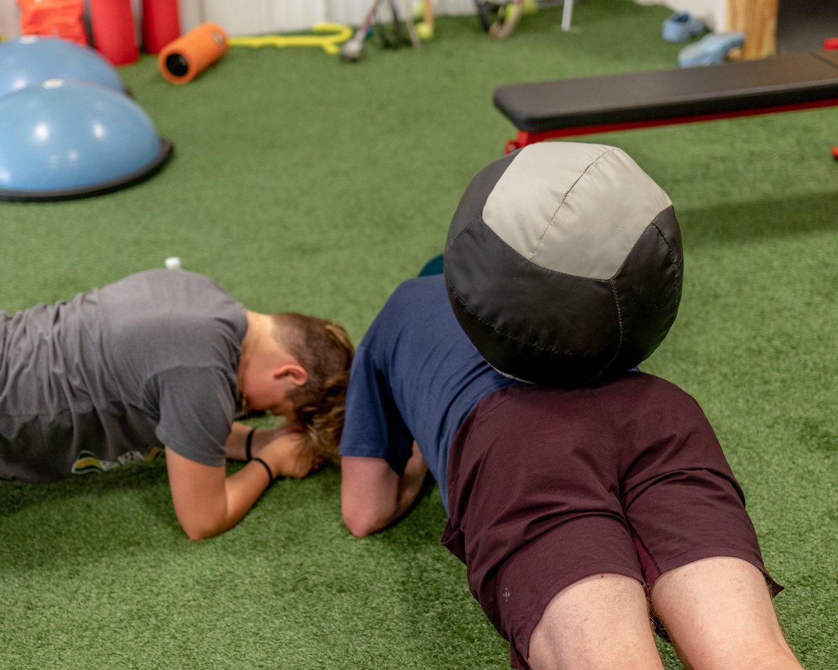 OPTMinot's tweet photo. Workout Advice:

If planks aren’t hard enough already, throw a 12 lb ball on your back like @aschoenborn22 https://t.co/RqpEJVz3B7