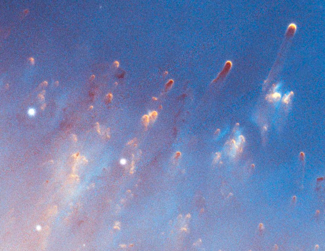 Bonus picture! Detailed images near the center of the nebula reveal "cometary knots," so called because of their resemblance to comets. Each knot, not incl. the tail, is about the size of a solar system, and is comprised of cold molecular gas surrounded by a shell of ionized gas.