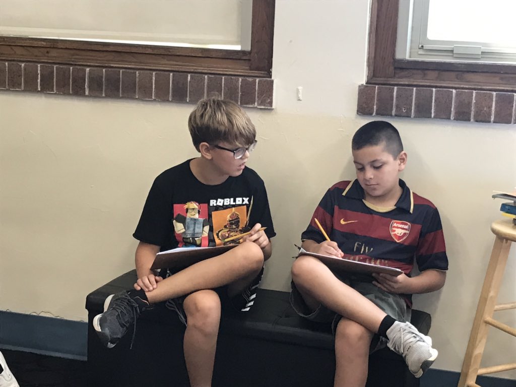 Working together to figure out what genre the text could be. #d70raptors