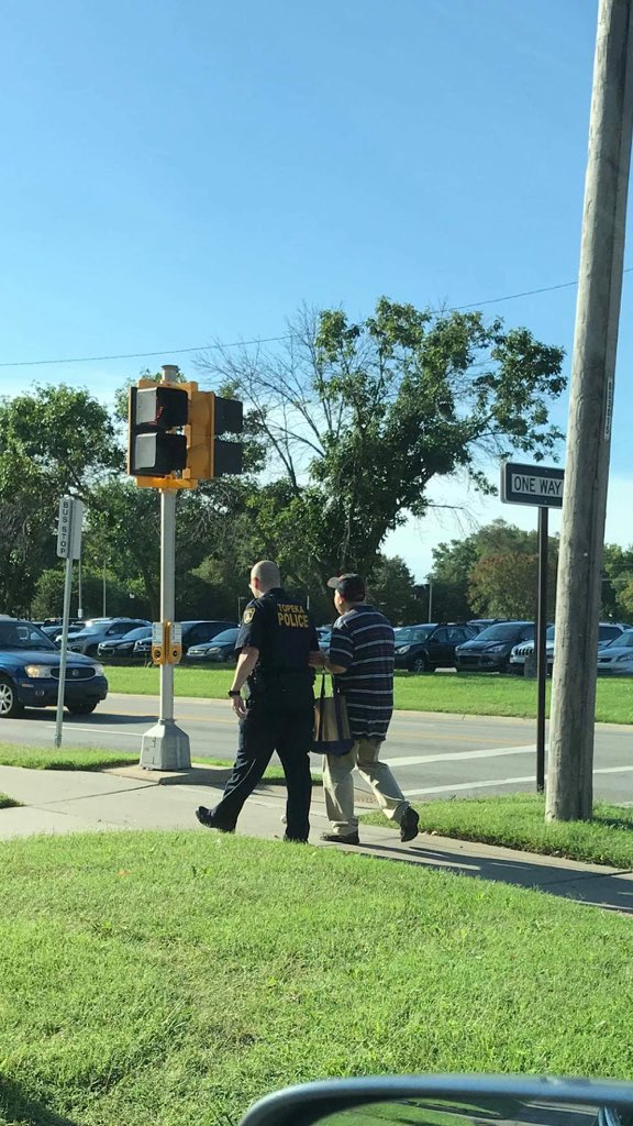 Going beyond the call of duty is something our officers do daily. These moments are rarely captured, but thanks to great community members, we are seeing more of them. We received this photo of one of our officers helping a blind man cross a busy intersection. #TopekaProud