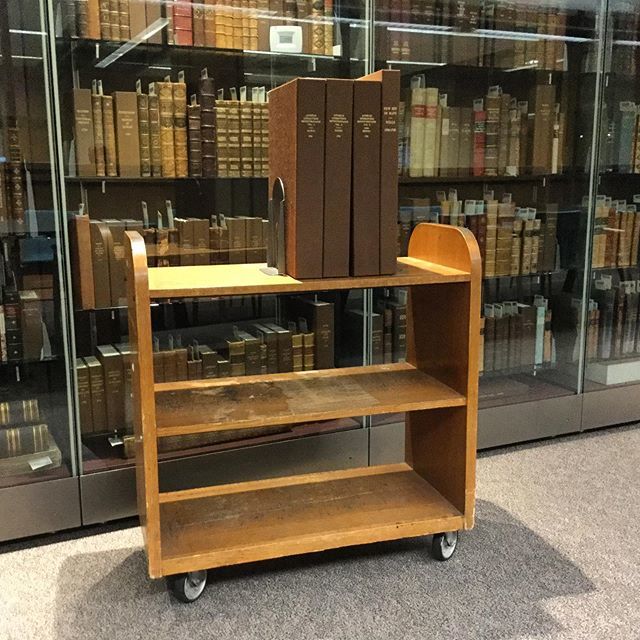 jordan_library's tweet photo. The humble book truck is our last #toolsofthelibrarytrade post. It would be impossible to do our work without them. This particular trolley has been around for awhile, and is a favourite of our Services Assistant, Jacques. #booktrucks #specialcollections… https://t.co/d65OUFuIVN https://t.co/jdHLbIL4Gd