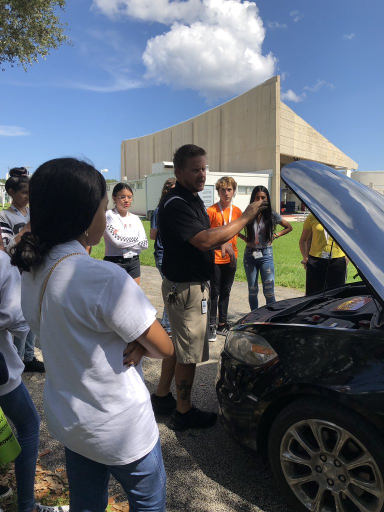 AmyTift's tweet photo. This year, 9th grade aftercare started a weekly "Adulting 101" workshop. For our first workshop, Mr. Smith taught our students basic car maintenance skills such as changing a tire and checking the oil. Thanks Mr. Smith! #owlsignite #owlsimpact @ADHUS_FAUHS #fauhighschool https://t.co/nzlHOCHvgb