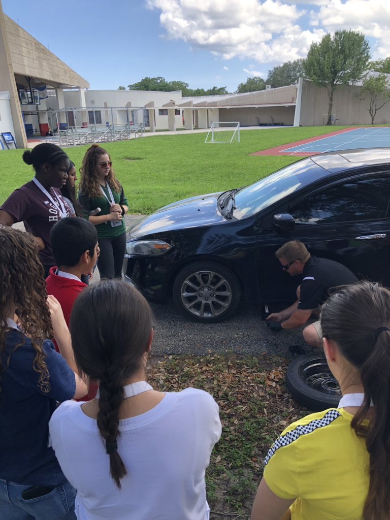 AmyTift's tweet photo. This year, 9th grade aftercare started a weekly "Adulting 101" workshop. For our first workshop, Mr. Smith taught our students basic car maintenance skills such as changing a tire and checking the oil. Thanks Mr. Smith! #owlsignite #owlsimpact @ADHUS_FAUHS #fauhighschool https://t.co/nzlHOCHvgb