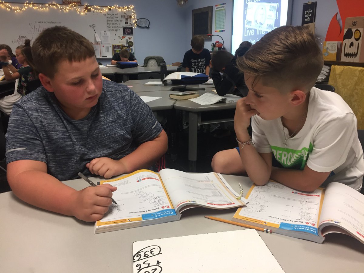 Discussing long division.  #BeActon   #workingtogether   #mathiscool