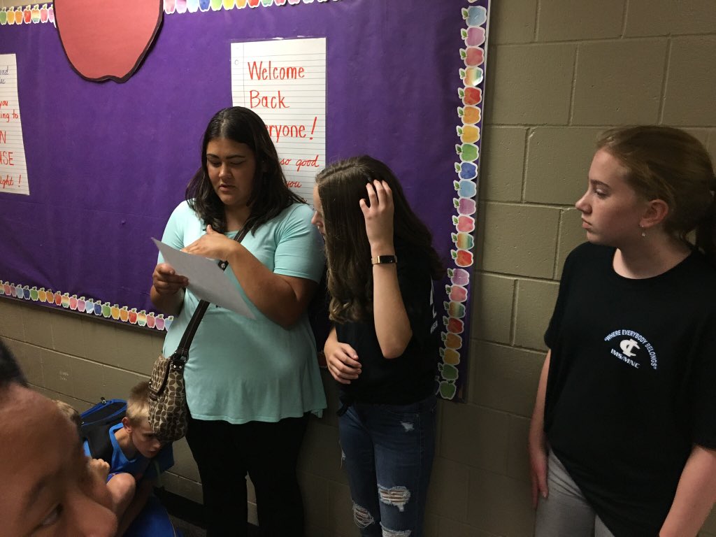 WEB leaders helping 6th grade parents and students.