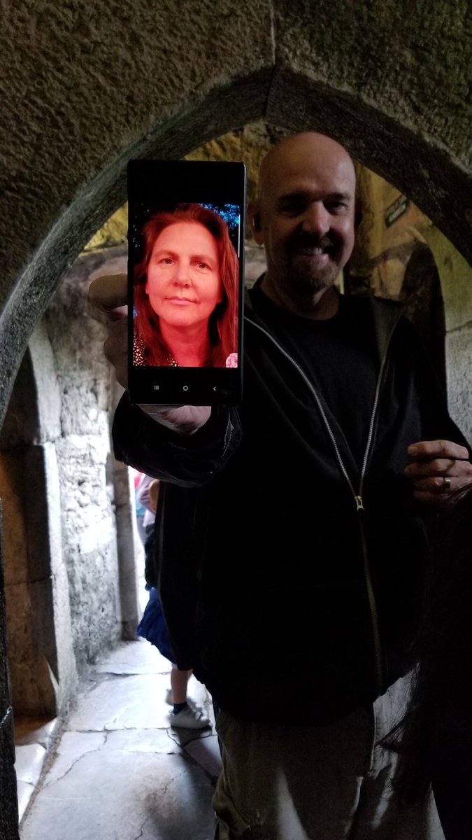 KnightsCathy's tweet photo. This one is a stretch . . . The closest I got too global travel this Summer was that my dear friends took digital Cathy to Ireland and the Blarney Castle, while I spent the evenings with their dog Macy bingeing HBO. #ECSKnightlyNews #SummerSelfieChallenge #GlobalTravelSelfie https://t.co/1NZ9YP83iS