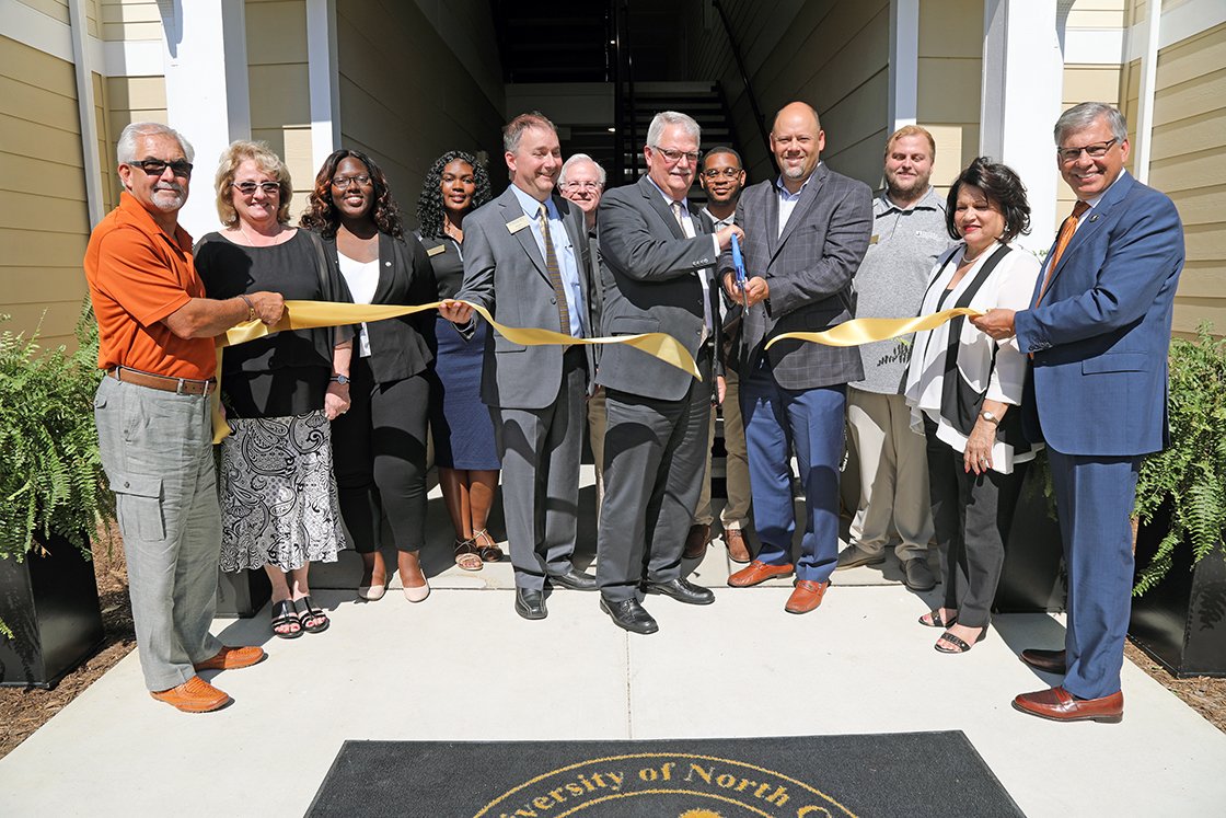 uncpembroke's tweet photo. Gorgeous day to celebrate the expansion of our University Courtyard Apartments. Love seeing growth in #BraveNation! https://t.co/b0JlqYFwHI