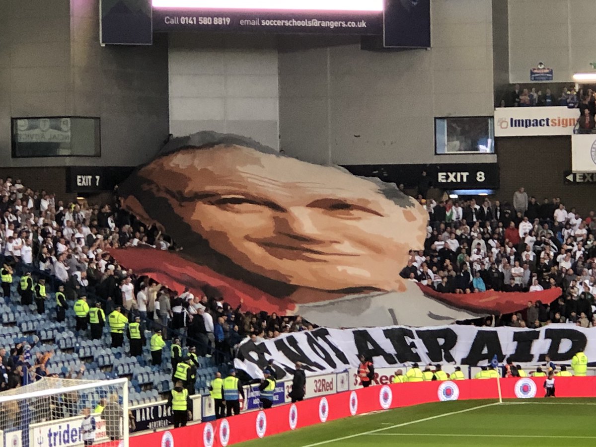 Legia fans have just unveiled a huge flag of Pope John Paul II at Ibrox.