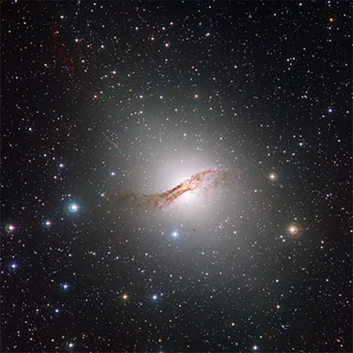 A visible-light view of part of the galaxy Centaurus A, with stars, dark dusty filaments, and pink nebulas marking star-forming regions
