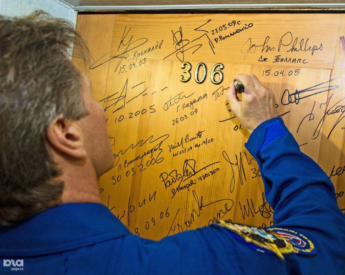 The cosmonauts sign the doors of their Cosmonaut Hotel rooms. Those autographs stay there forever. I've also heard they sign a bottle of vodka that is opened on the day they come back to Earth. Most of the cosmonauts believe that signing anything before that day brings misfortune