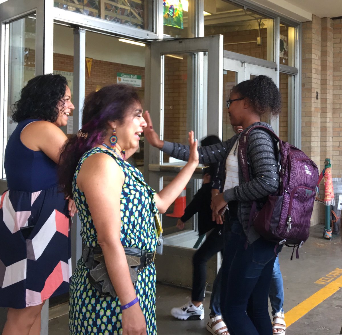 PPSConnect's tweet photo. Latinx leaders welcoming students to K-8 School. A few morning sprinkles didn’t dampen spirits! #1DistrictPPS https://t.co/mmdzSZM9Ep