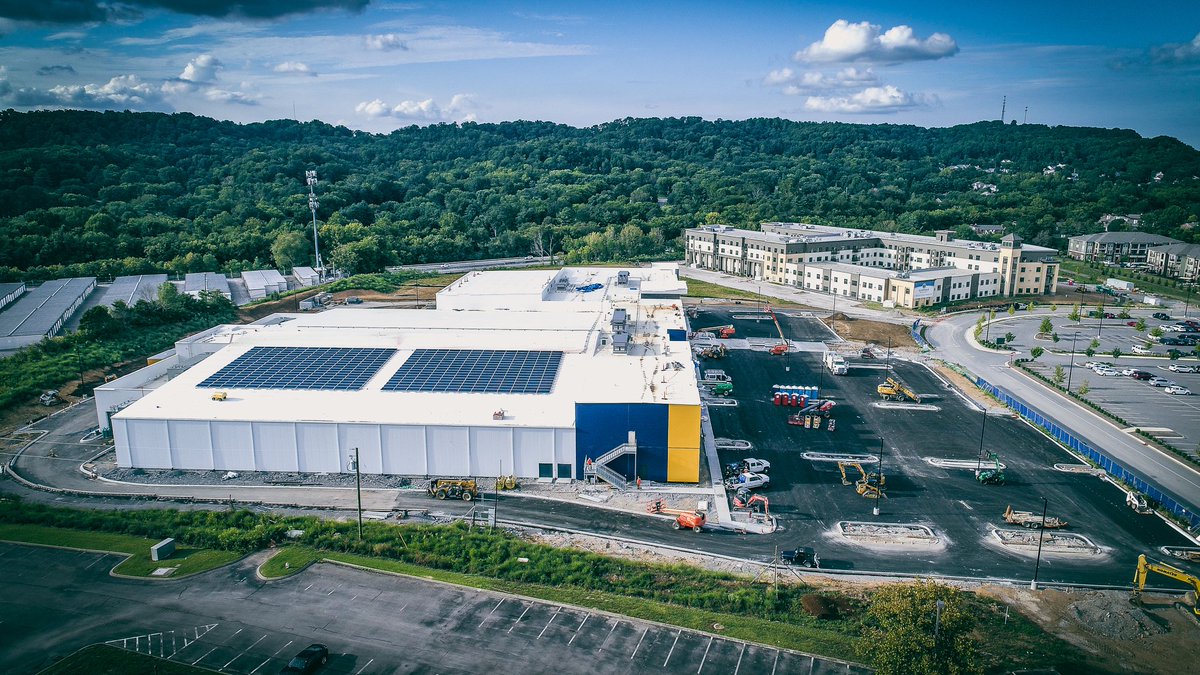 AmericanConst's tweet photo. 👉 Exterior: Binder (paving) &amp; curbs are completed, topsoil/landscaping are ongoing &amp; we’re detailing exterior skin of building. Interior: Even more activity - we have power/air so progressing on finishes like paint, flooring, etc. Won't be long! #bellevuetn #fordicecenter #preds https://t.co/audoYLNhZN