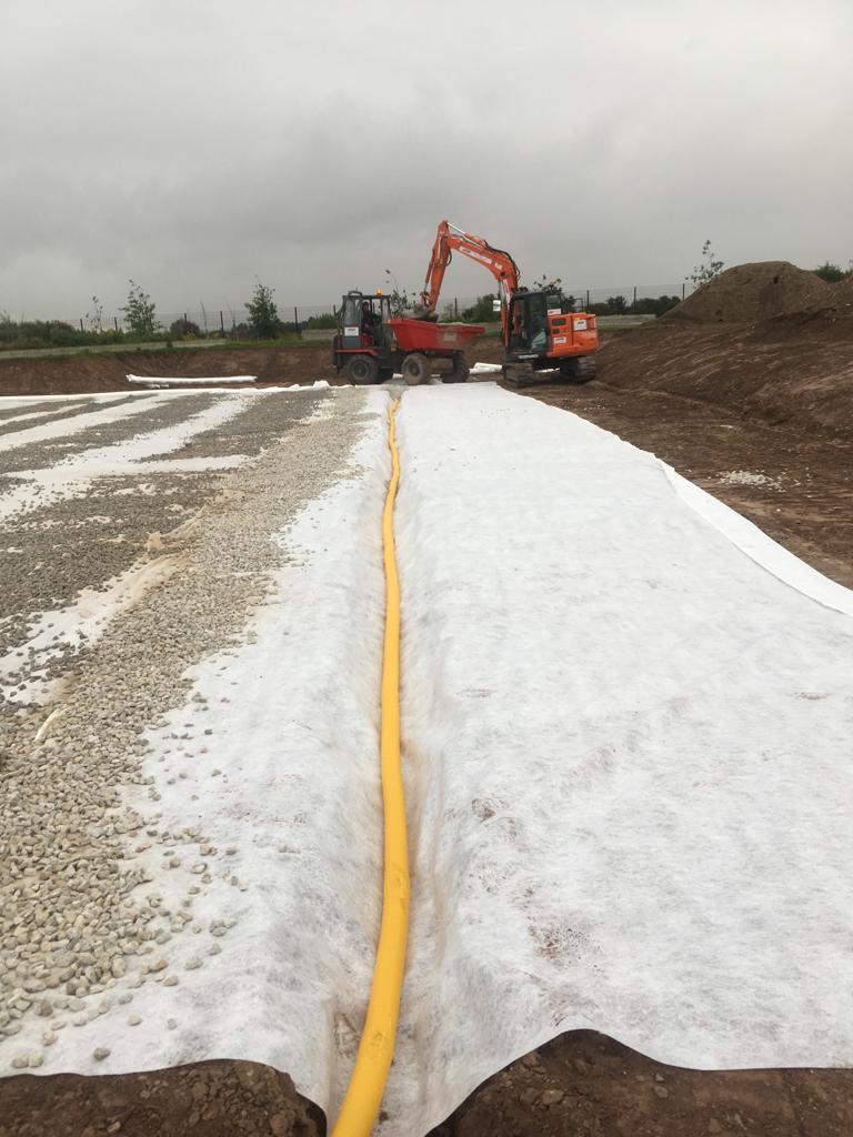 PST_Sport's tweet photo. Groundworks phase well underway at Gaelscoil Mhainistir Na Corann in Midleton, Co. Cork for a 1,500 sq/m 3G pitch with kerbing, fencing, netting, goal posts, ducting & bases for lighting & ball wall.
#YourPitchOurPassion
#CompleteTurnKeySolution https://t.co/PUfOIe6LtG