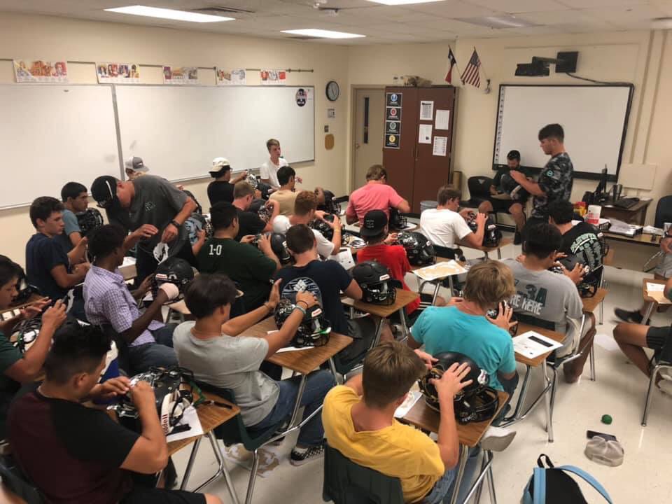 GAME DAY BABY!!! Varsity football putting their decals on their helmets!  #SicEm #Family #BulldogWay #FridayNightLights @MarionHsTx @Marion_Bulldogs @THSCAcoaches