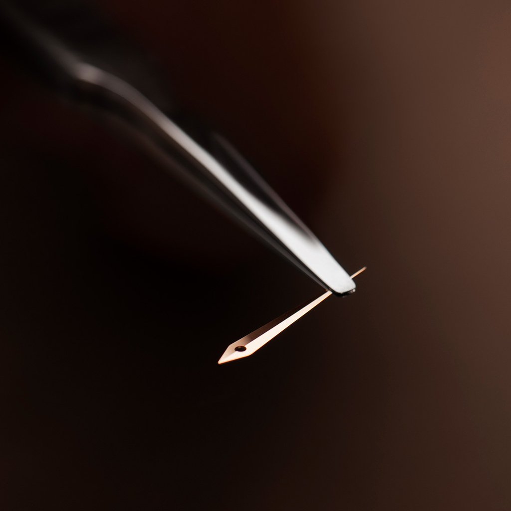 A delicate dauphine-shaped hand,  subtly catching the light.

#AteliersdeMonaco #dMc #Watchmaking #Horology #Horlogerie #Watchmaker #Horloger #Craftsmanship #SavoirFaire #Watch #Montre #Timepiece #Switzerland #Suisse #Geneva #Geneve #Aiguillage #HandFitting #Tweezers #Brucelles