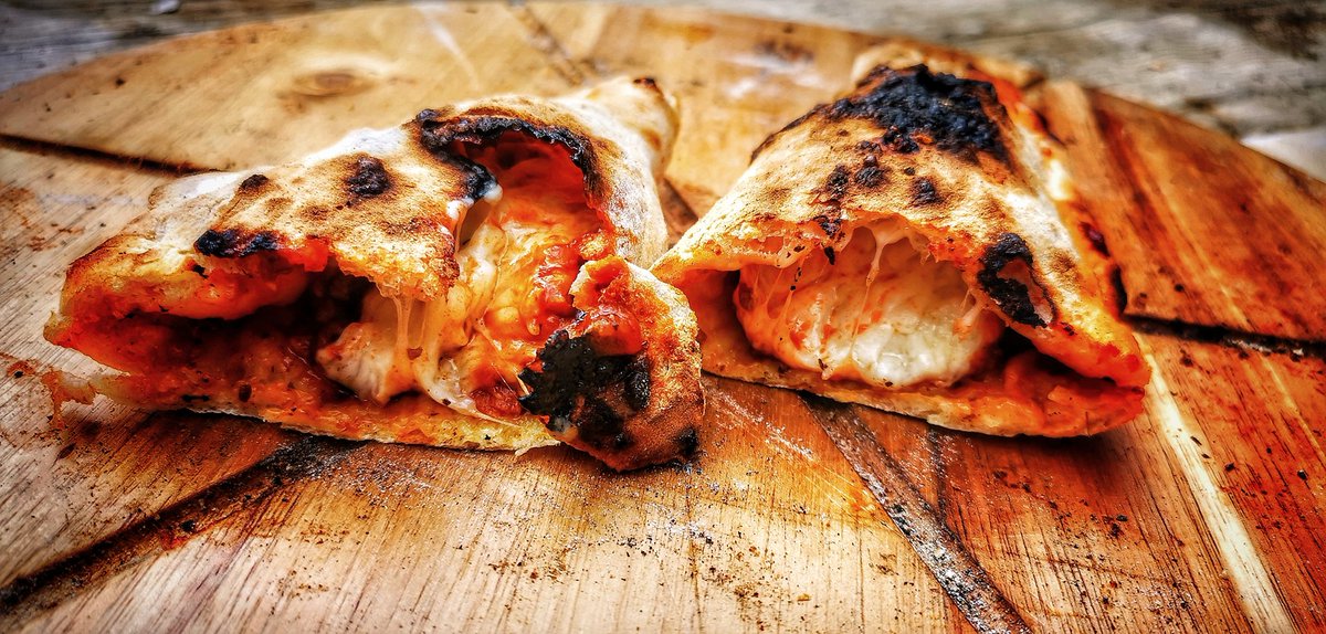 Ragu and cheddar calzone for lunch... Very tasty... Cooked in the <a href="/BushmanOvens/">Bushman Ovens</a> Santorini wood fired oven, with a chilled glass of <a href="/GardenOfItaly/">Garden Of Italy</a> Pigno #woodfired