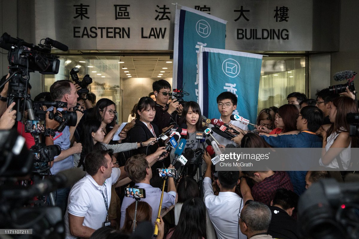 GettyImagesNews's tweet photo. Hong Kong pro-democracy activists Agnes Chow (L) and Joshua Wong speak to the media after being arrested and released on bail on August 30, 2019 in Hong Kong, China. 📷: @cmcgrath_photo #HongKongProtests https://t.co/hP9nSXnxFY