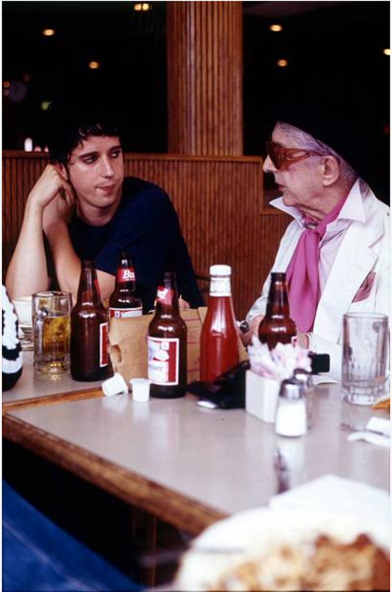 Quentin Crisp in a New York diner. He's with Julian Hewings (aka Hooligan) of the British rock band These Animal MenPhoto: Martyn Goodacre, 1995You called it,  @mikelark!