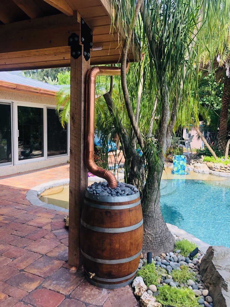 Copper Gutter with Aged Wine Barrel and Rain Water Catcher!  Re use the rain water to water your yard or plants!
Call for your FREE ESTIMATE!  #GutterCleaning GutterGuard #WineBarrel #SeamlessGutters #RecycleWater     #ClogFreeGutters #CustomGutters #WePutWaterInItsPlace