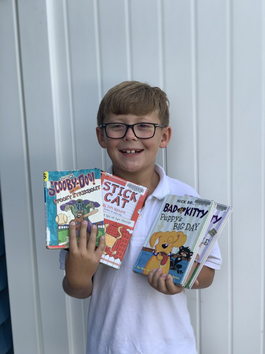 JMiodynski's tweet photo. A couple of very happy Miodynski Munchkins!! Madelynn signed up for her very own #NLlibrary card!! Joshua can’t wait to finish the #BadKitty series and dive into more #ScoobyDoo and see what #stickcat is all about!! https://t.co/cjmip512oV