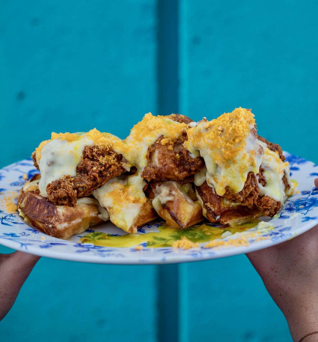 CHEESY. CHICKEN. WAFFLEZZZZ. 😱⠀
⠀
Our waffle recipe has been handed down through generations, and these ones are covered in fried chicken, AB cheesy sauce, and CHEETOH DUST 🍗🧀⠀
⠀