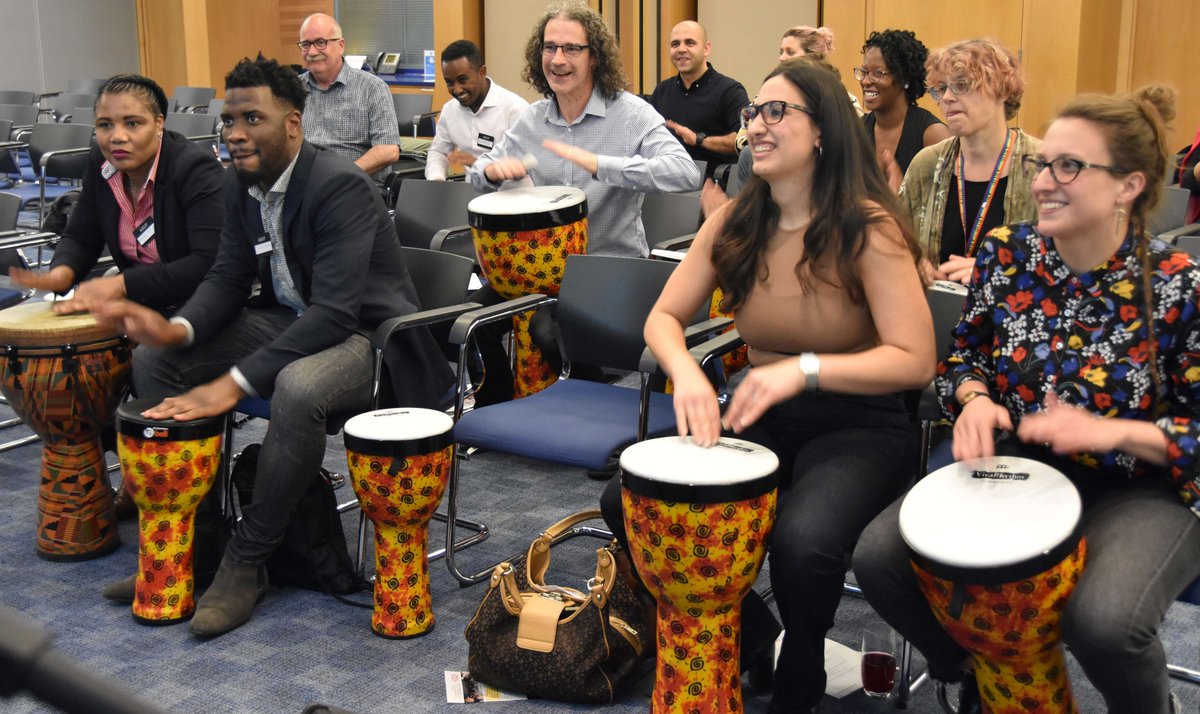 MFW_UK's tweet photo. In the world refugee week, Music for Wellness ran a drumming session for Arup employees to celebrate diversity and inclusion.
#diversity #recruitment
#Teambuilding #Drumming #Icebreaker #Musicforwellness #FunTeambuilding #EffectiveTeambuilding #Arup
#London #corporateevents https://t.co/3mffdTAnzD