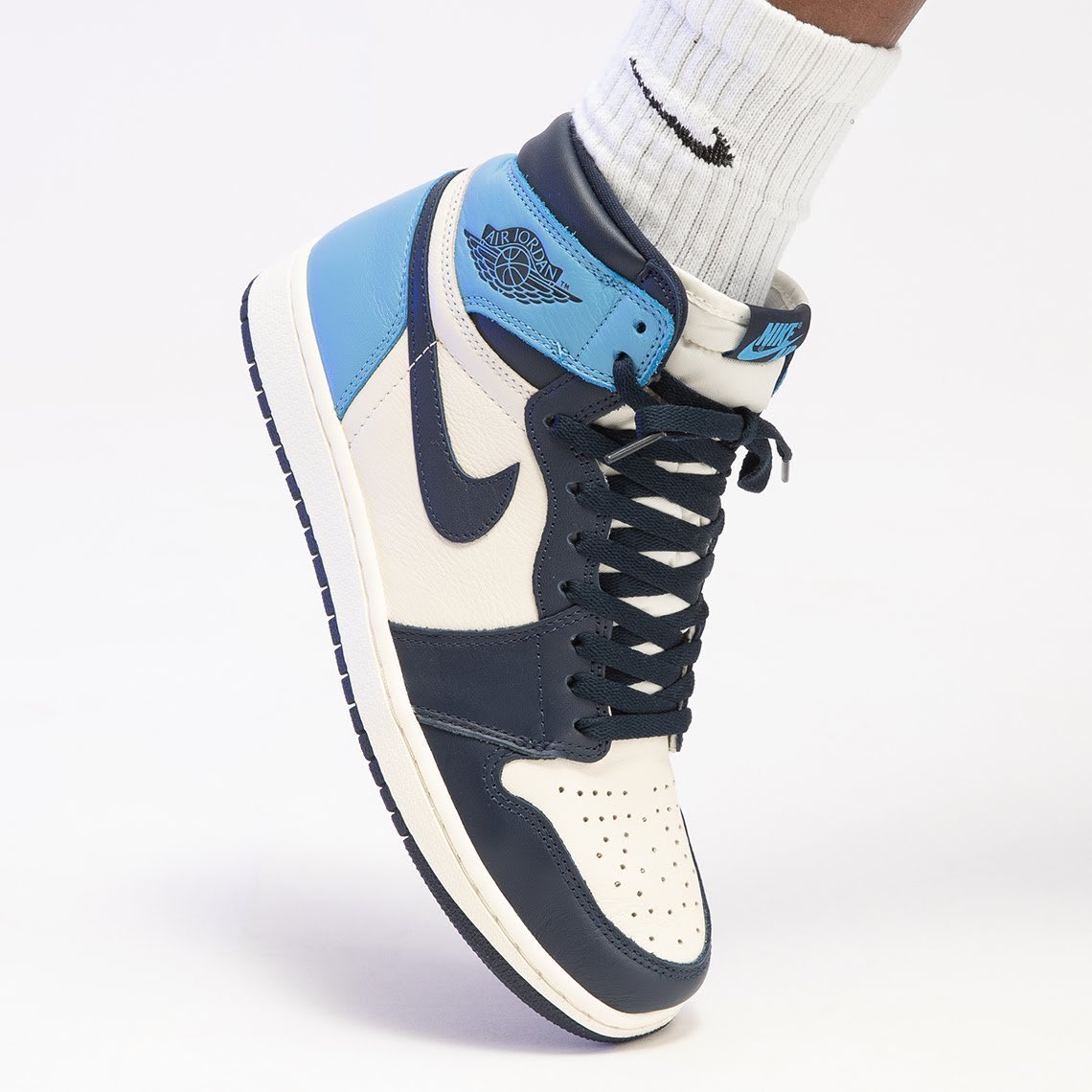 The Jordan 1 Returns In A New Colorway
The UNC Tar Heels’ classic powder blue colorway returns to the Jordan 1 High OG with dark obsidian. 
The sneaker released today retailing for $160. If you weren’t able to secure your pair, it’s too late because the shoes are sold out!