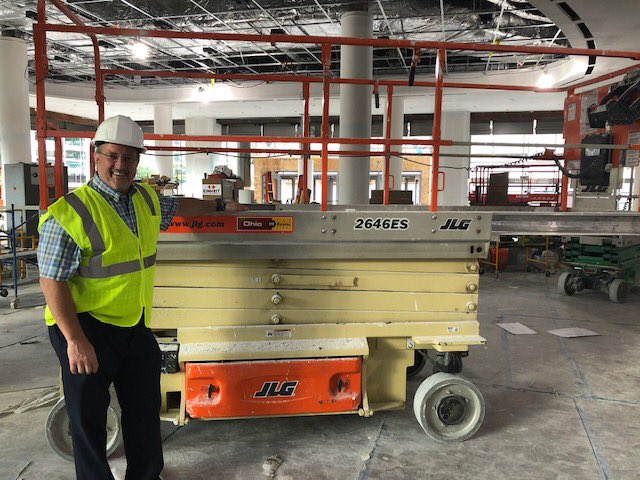 OhioCAT1's tweet photo. The @RMFieldHouse  transformation is nearly complete. We’re excited about the changes as part of Cleveland’s growth.  Ken Taylor stands by one of our rental aerial lifts in the building during a recent tour.  #clevelandlife #rentalequipment #ibuildamericaohio #catequipment @cavs https://t.co/uR7Cw5wXy8