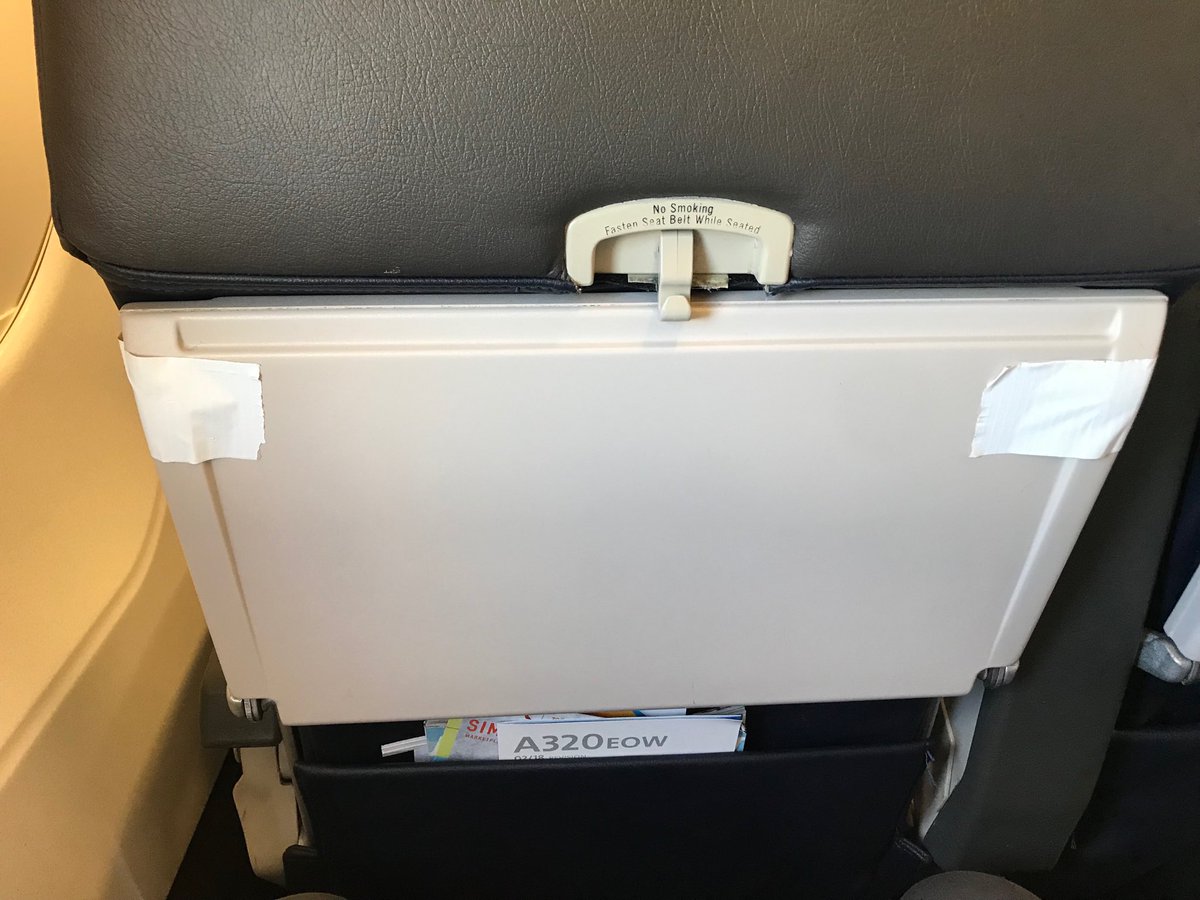 ⁦<a href="/AmericanAir/">americanair</a>⁩ fail. Seems American is now taping the backseat tables to insure leg space. Wtf?!