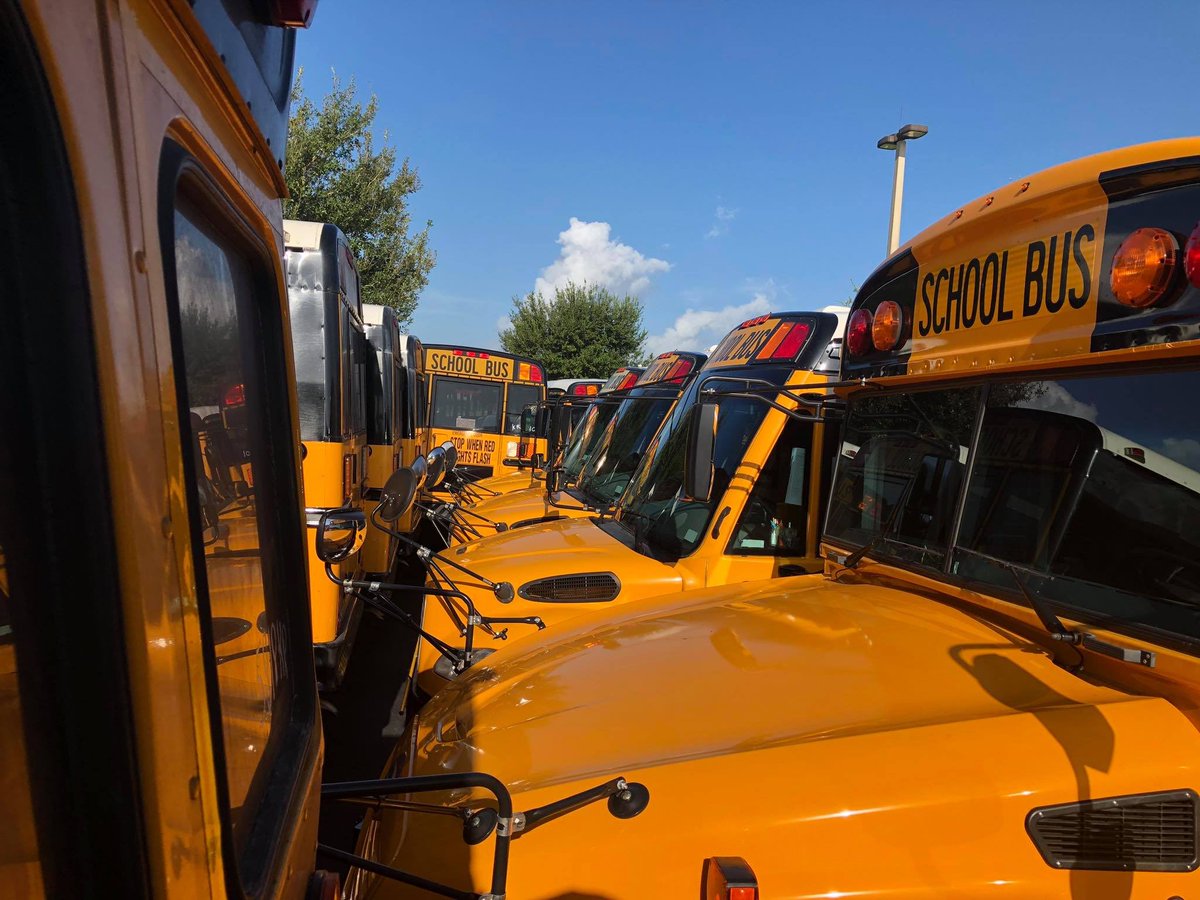 OCPSnews's tweet photo. #HurricaneDorian prep: Buses are  parked as close as possible to prevent wind from blowing open the doors. Older buses are on the outer perimeter to protect newer vehicles. https://t.co/TNBdAySwDz